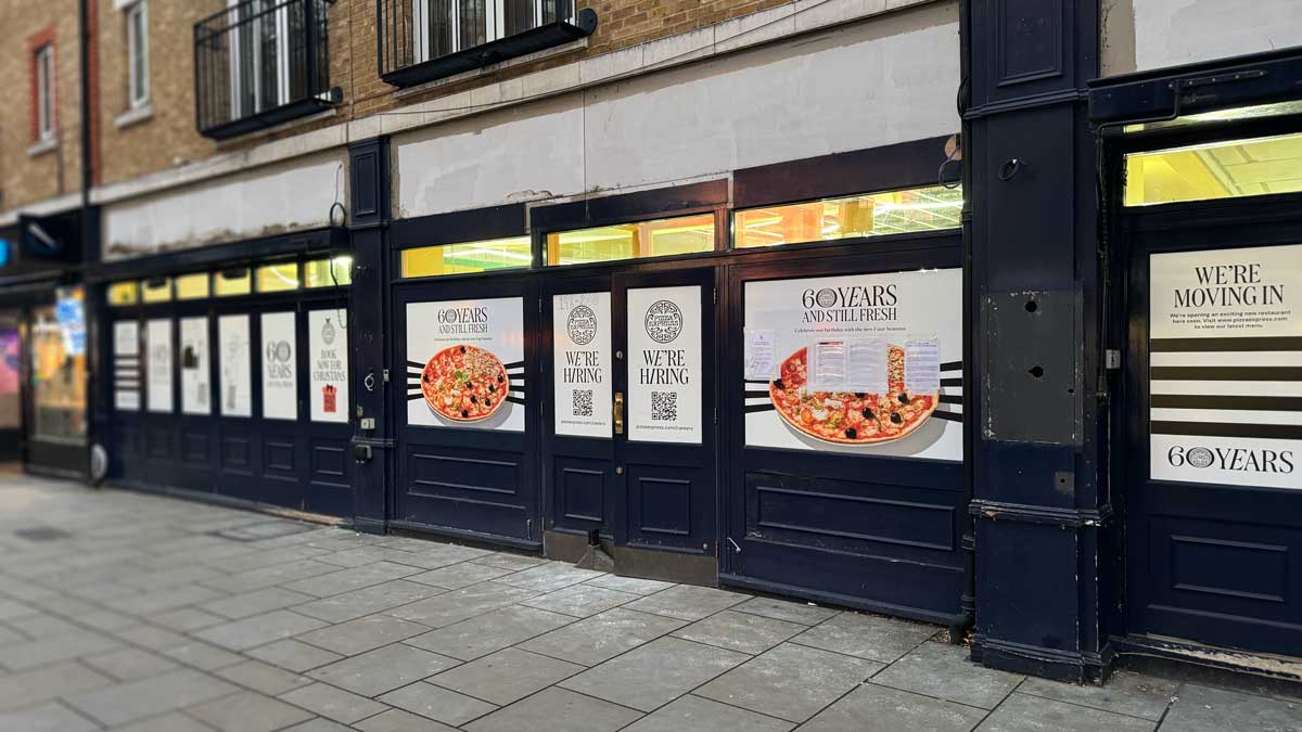 Pizza express with windows covered while works take place